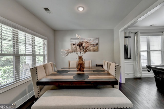 dining space featuring dark hardwood / wood-style flooring