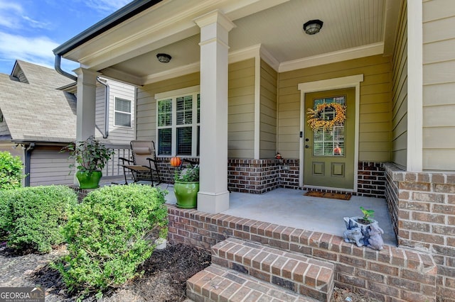 entrance to property featuring a porch