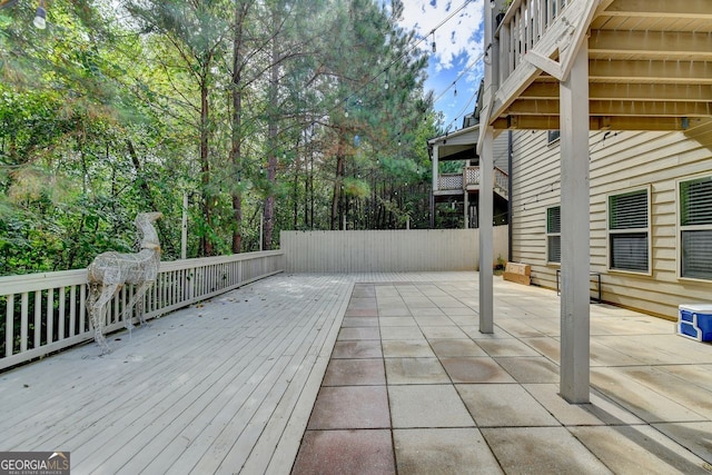 wooden deck featuring a patio area