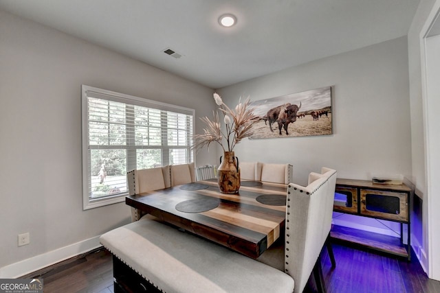 dining space featuring dark wood-type flooring