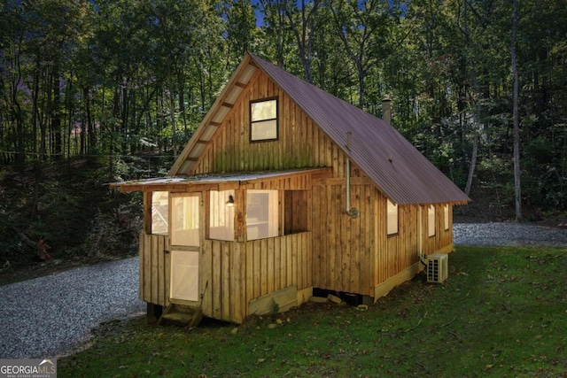 view of outdoor structure with ac unit and an outdoor structure