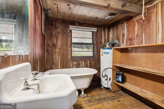 bathroom featuring gas water heater, wood ceiling, a sink, wooden walls, and hardwood / wood-style flooring