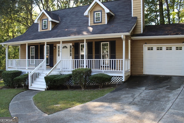 new england style home with a porch and a garage