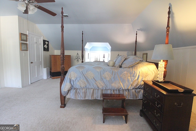 bedroom with light carpet, ceiling fan, and vaulted ceiling