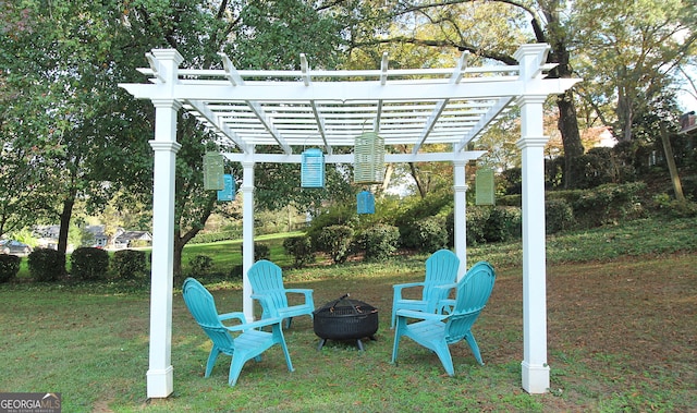 exterior space with a fire pit and a pergola