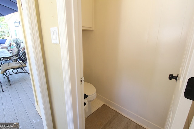 bathroom featuring tile patterned floors and toilet