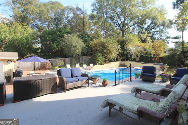 view of pool featuring a wooden deck and an outdoor hangout area