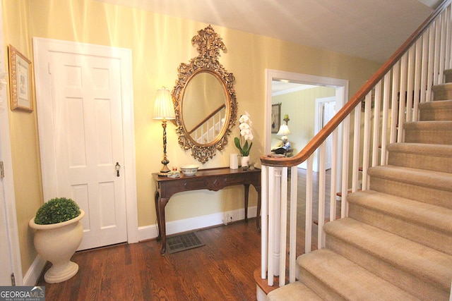 staircase featuring hardwood / wood-style flooring