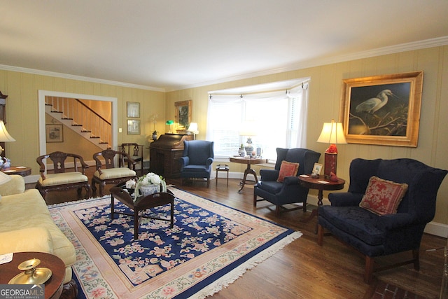 living room featuring dark hardwood / wood-style flooring and crown molding