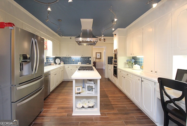 kitchen with island range hood, stainless steel appliances, a kitchen island, white cabinets, and dark wood-type flooring