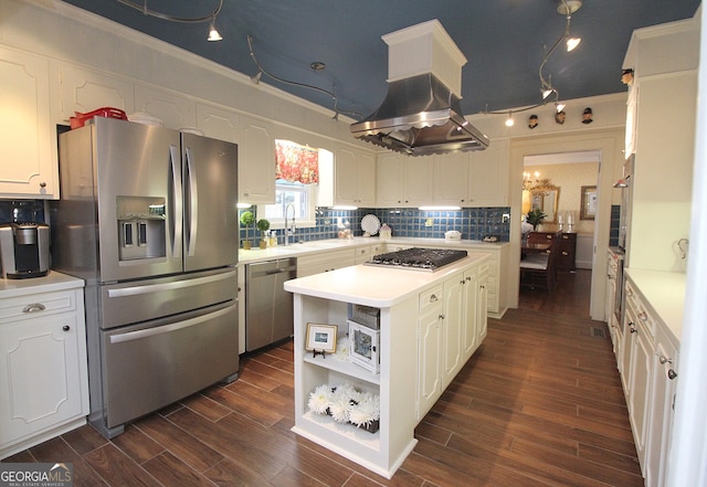 kitchen featuring a center island, decorative backsplash, dark hardwood / wood-style floors, and stainless steel appliances