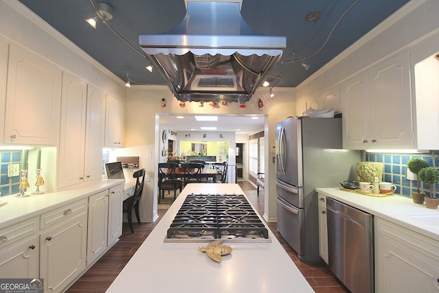 kitchen with stainless steel appliances, dark hardwood / wood-style floors, white cabinets, and exhaust hood