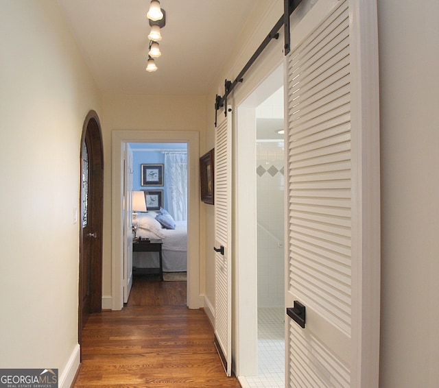 hall with dark hardwood / wood-style floors