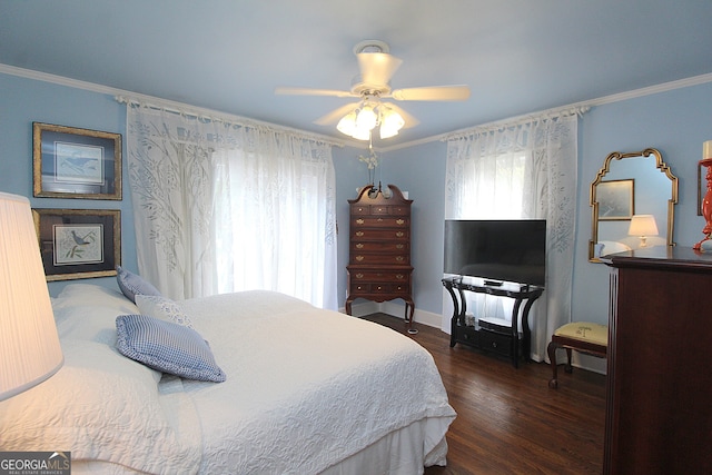 bedroom featuring ceiling fan, dark hardwood / wood-style flooring, and ornamental molding