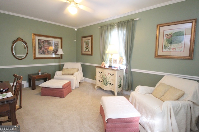 living area with ornamental molding, light carpet, and ceiling fan