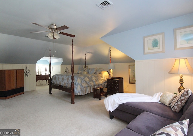 bedroom with light colored carpet, lofted ceiling, and ceiling fan