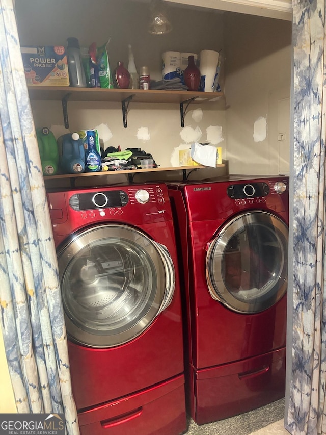 laundry area with washing machine and dryer