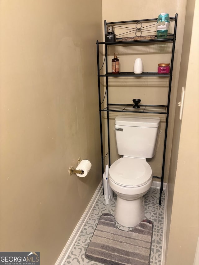 bathroom featuring tile patterned floors and toilet