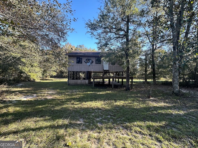 view of yard featuring a wooden deck