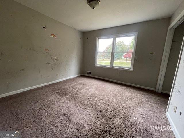 unfurnished room with carpet floors