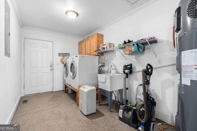 clothes washing area with electric water heater, washer and dryer, light colored carpet, and cabinets