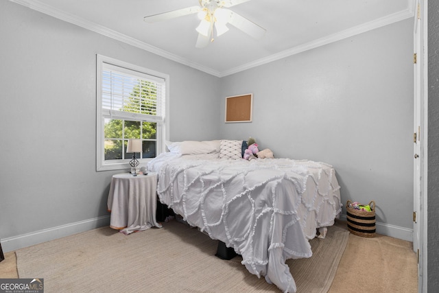 bedroom with ornamental molding, light colored carpet, and ceiling fan