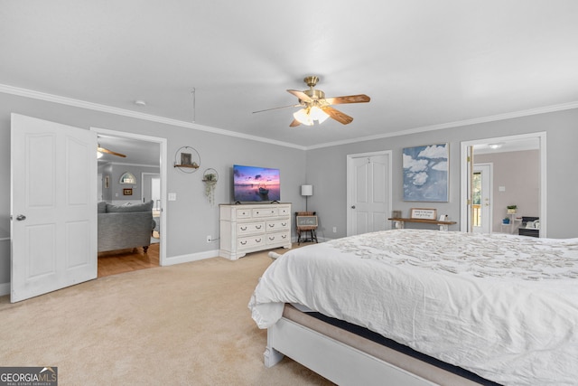 bedroom with ceiling fan, light colored carpet, a closet, and ornamental molding