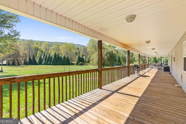 wooden deck with a yard