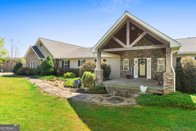 view of front of home featuring a front yard and covered porch