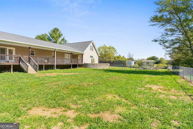 view of yard featuring a wooden deck