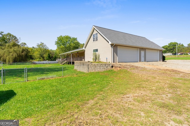 view of property exterior featuring a yard and a garage