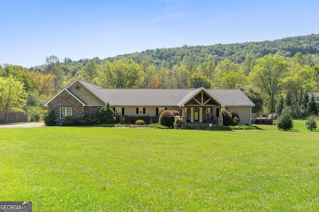 ranch-style home with a front lawn and covered porch