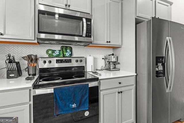 kitchen with backsplash and stainless steel appliances