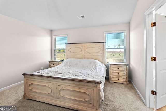 bedroom with light colored carpet