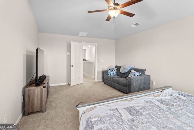 carpeted bedroom with ceiling fan and vaulted ceiling