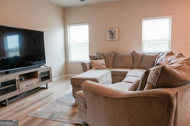 living room with light hardwood / wood-style flooring