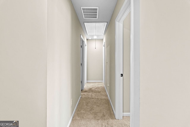 corridor with light colored carpet