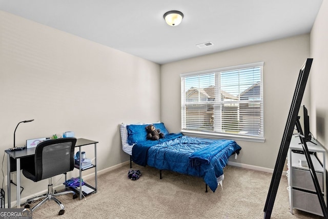 bedroom with light colored carpet