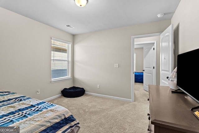 bedroom with light carpet