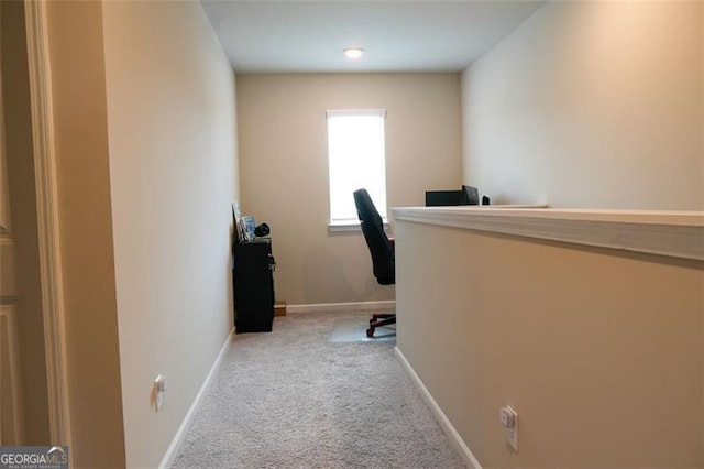 office area featuring light colored carpet