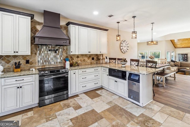 kitchen featuring premium range hood, a kitchen breakfast bar, decorative light fixtures, kitchen peninsula, and stainless steel electric stove