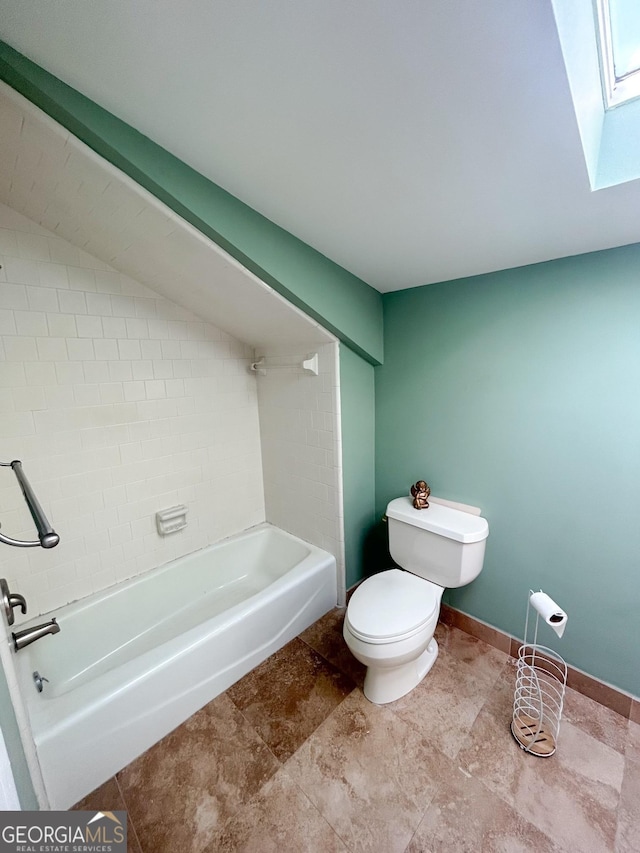 bathroom with toilet and shower / bathing tub combination