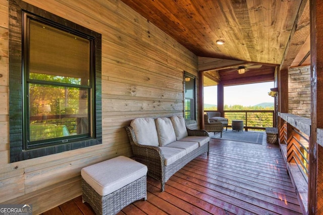 wooden terrace with outdoor lounge area