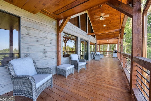 wooden deck featuring ceiling fan