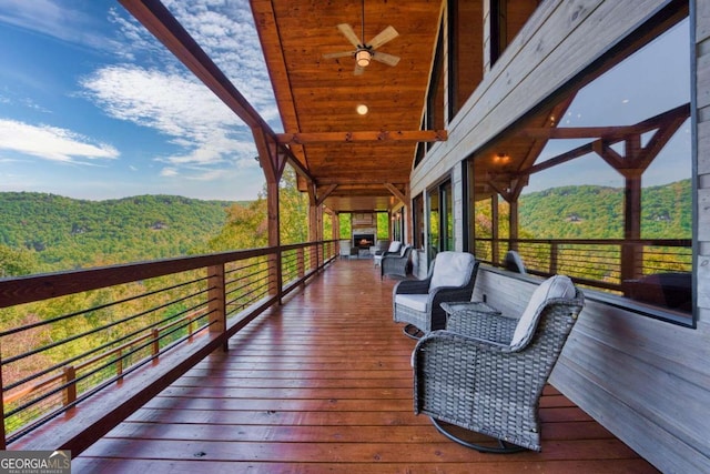 wooden deck with ceiling fan