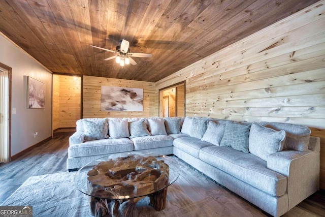 living room featuring ceiling fan, wood ceiling, dark hardwood / wood-style floors, and wood walls