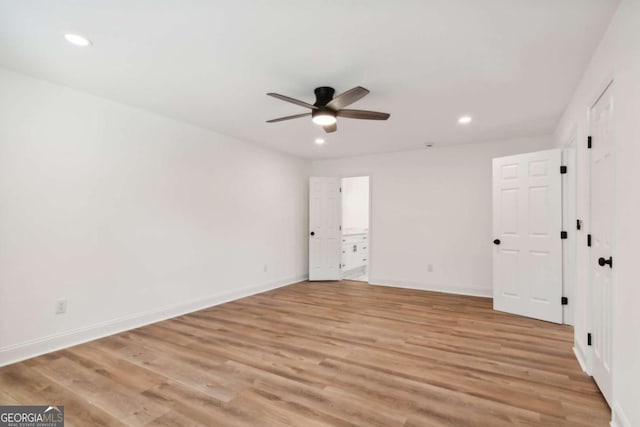 unfurnished bedroom featuring ceiling fan and light hardwood / wood-style flooring