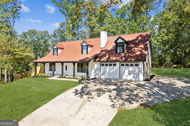 cape cod house featuring a porch, a front yard, and a garage