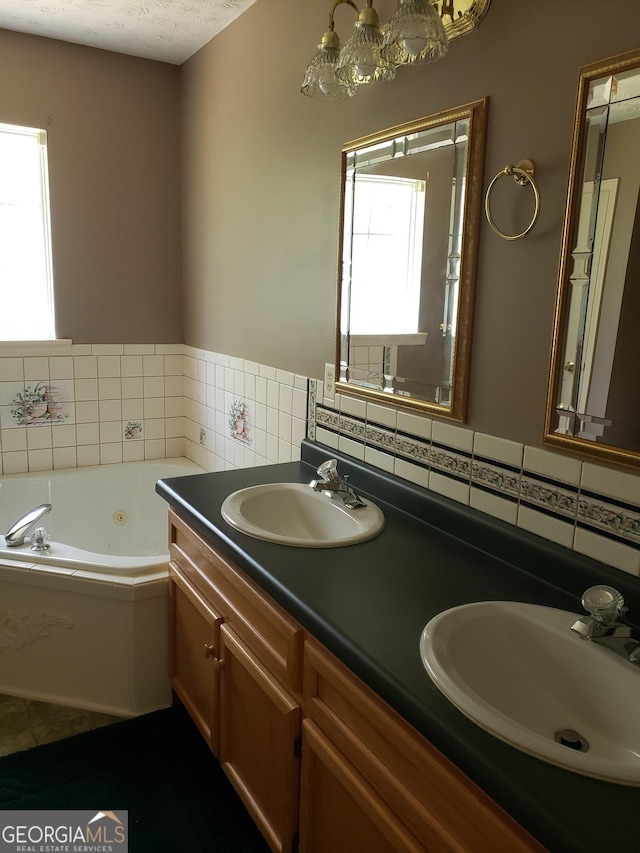 87 Mcmichael Way, Hoschton, GA 30548 - bathroom featuring tile walls, double vanity, and a whirlpool tub