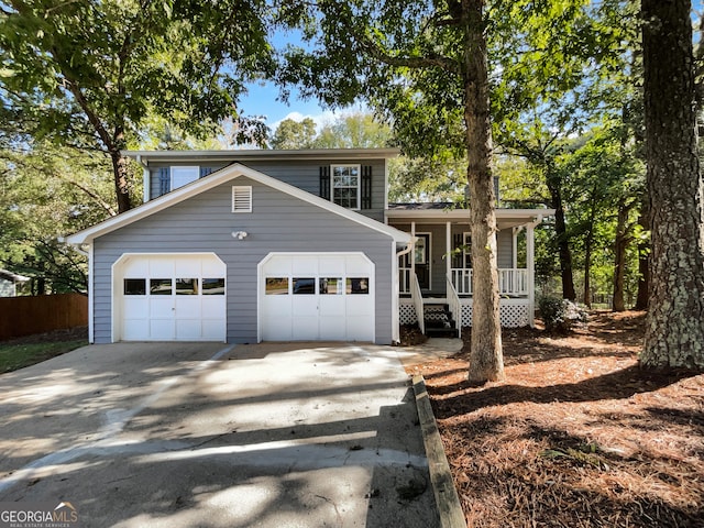 view of front of house featuring a porch and a garage